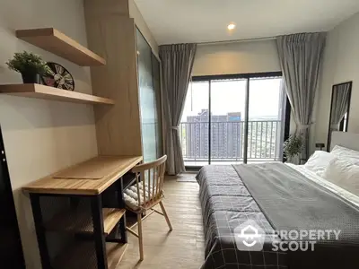 Modern bedroom with balcony view in high-rise apartment