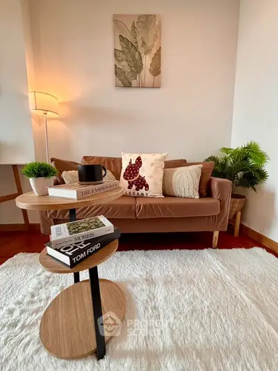 Stylish living room with cozy brown sofa, chic decor, and modern floor lamp on plush white rug.