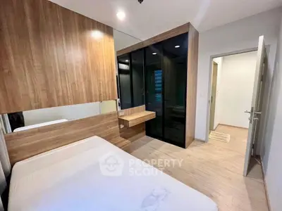 Modern bedroom with wooden accents and built-in wardrobe