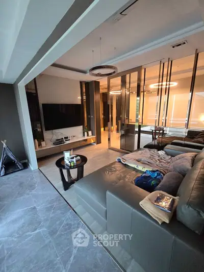 Luxurious modern living room with sleek design and large TV