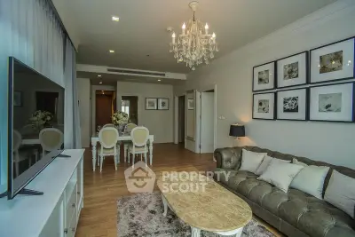 Elegant living room with chandelier and stylish decor in modern apartment