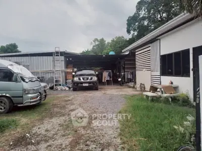 Spacious property with ample parking and outdoor storage space, ideal for commercial use.