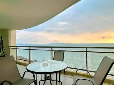 Stunning oceanfront balcony with breathtaking sunset views, perfect for relaxation and entertaining.
