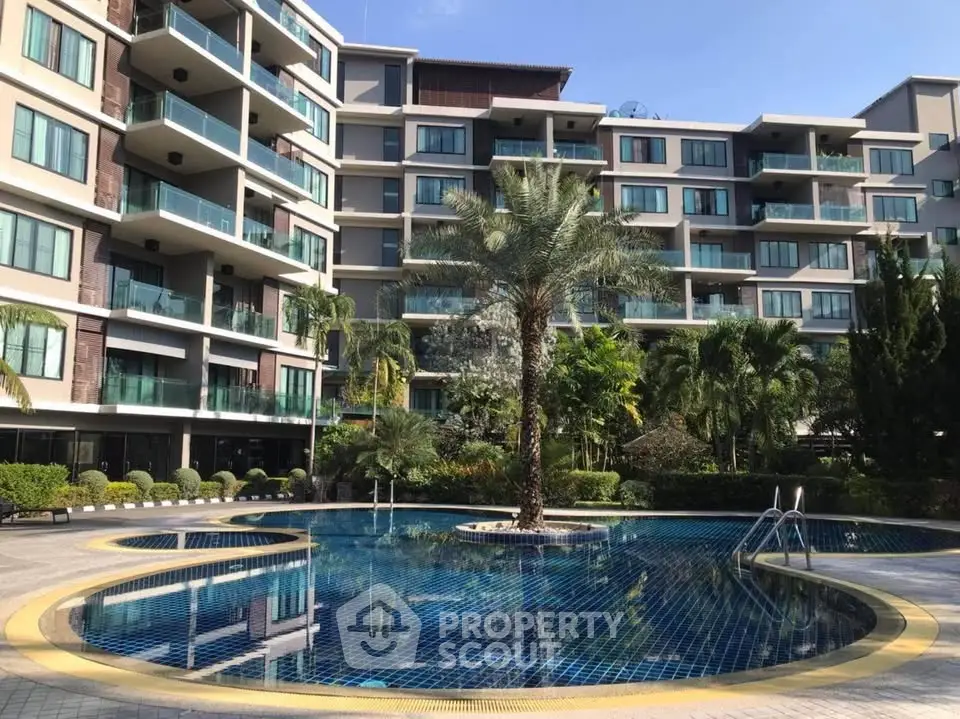 Luxurious condominium with stunning pool and lush landscaping