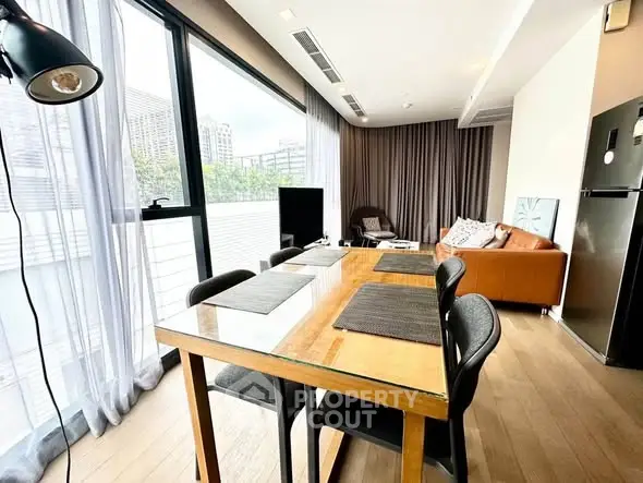 Spacious modern living room with dining area and large windows