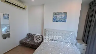Modern bedroom with air conditioning and stylish decor in a cozy apartment.