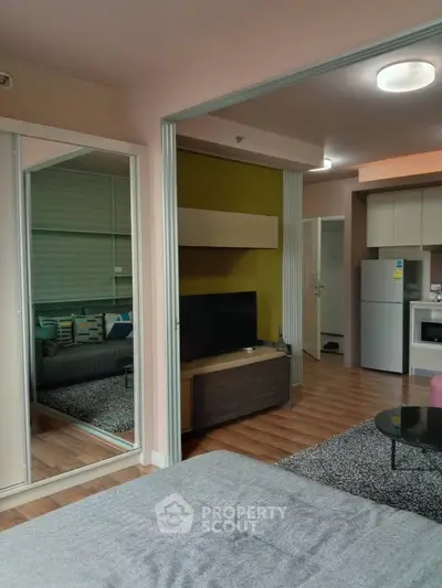 Modern open layout apartment with cozy living area and kitchen