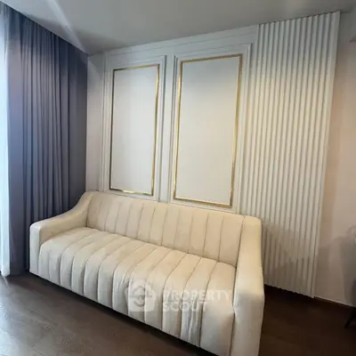 Elegant living room with plush beige sofa and stylish wall paneling