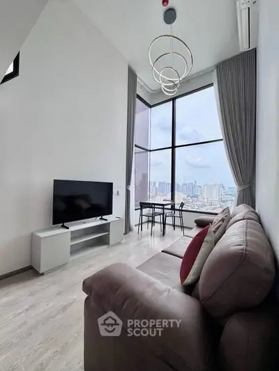 Stunning high-rise living room with floor-to-ceiling windows and city skyline view.