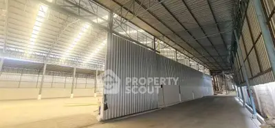 Spacious industrial warehouse with high ceilings and ample natural light