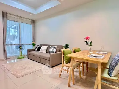 Charming living room with cozy sofa and dining area, perfect for modern living.