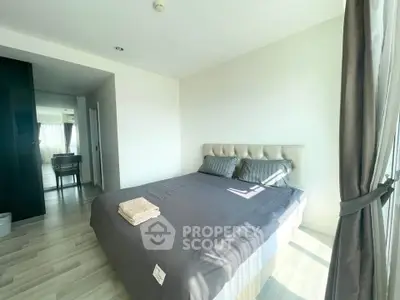 Bright and airy bedroom with modern decor and large windows in a stylish apartment.