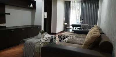 Spacious living room with modern decor and large windows for natural light.