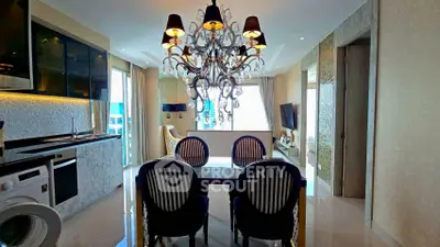 Luxurious dining area with elegant chandelier and modern kitchen appliances
