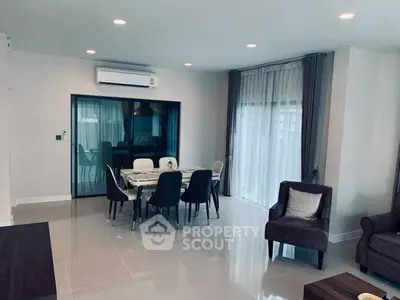 Modern living room with dining area and elegant furnishings