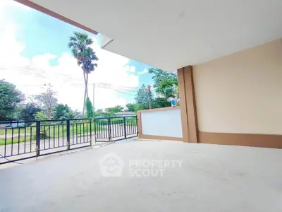 Spacious balcony with scenic view and modern railing design