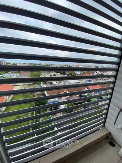 Stunning balcony view with cityscape and greenery, perfect for relaxation and enjoying the outdoors.