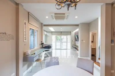 Spacious and modern open-layout kitchen with sleek countertops and ample natural light, perfect for entertaining and culinary enthusiasts.