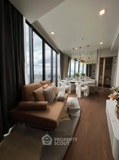 Luxurious modern living room with panoramic city views and elegant dining area.