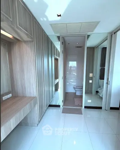 Modern bathroom with sleek design and wooden cabinetry