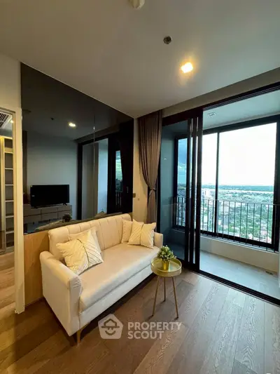 Modern living room with balcony and scenic view, featuring elegant sofa and wooden flooring.