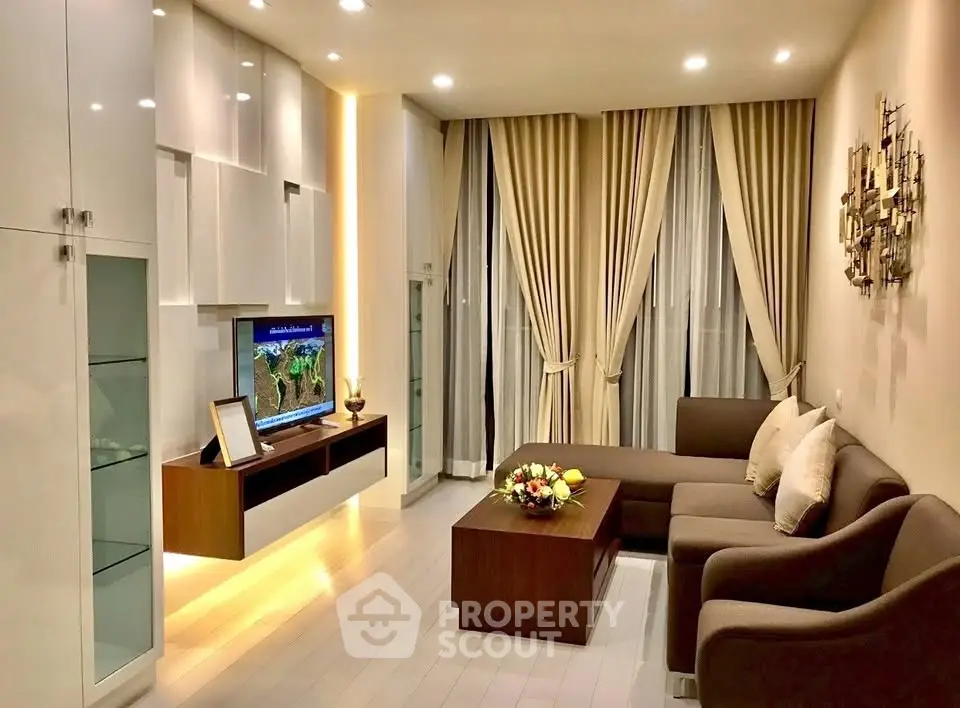 Elegant living room with modern furniture and ambient lighting, perfect for cozy evenings.