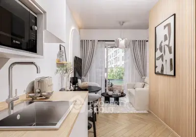 Modern living room with open kitchen, stylish decor, and natural light