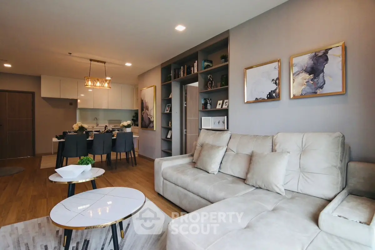 Modern living room with elegant decor and open kitchen layout