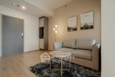 Modern living room with cozy sofa, stylish decor, and elegant lighting