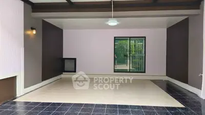 Spacious modern interior with tiled flooring and large window