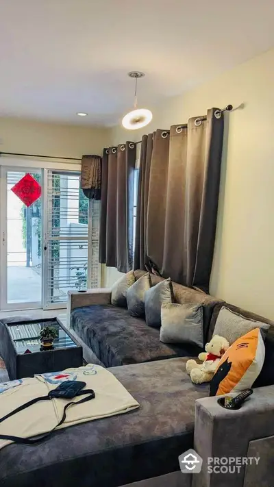 Cozy living room with plush gray sofa and modern decor