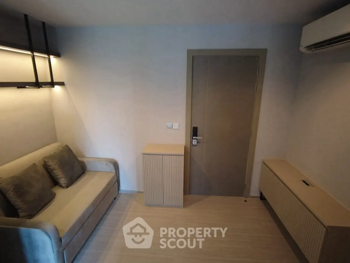 Cozy modern living room with sofa and air conditioning