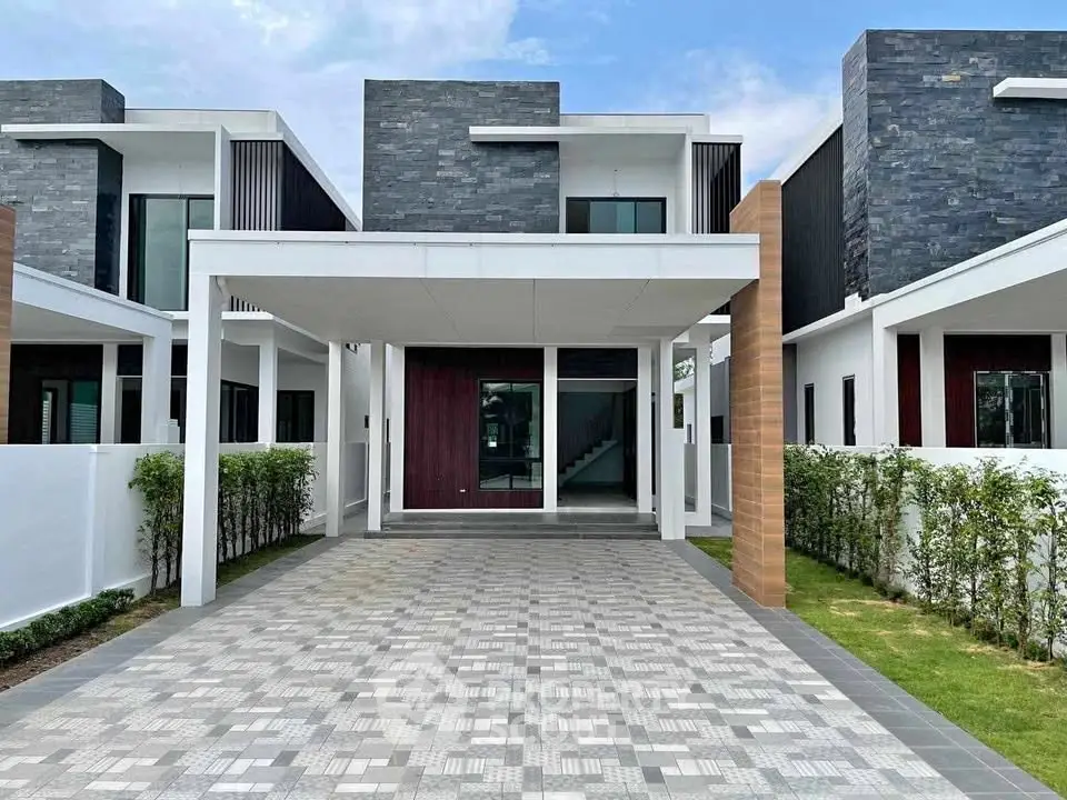 Modern two-story house with sleek design and spacious driveway