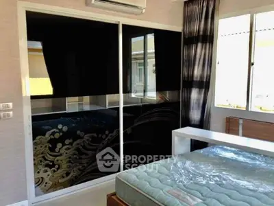 Modern bedroom with stylish wardrobe and natural light