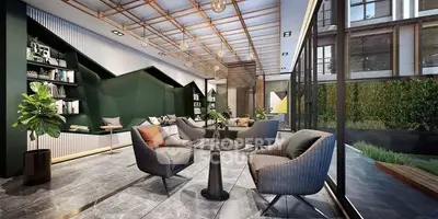 Luxurious open-plan living space with high ceilings, modern furniture, and floor-to-ceiling windows overlooking a private garden.