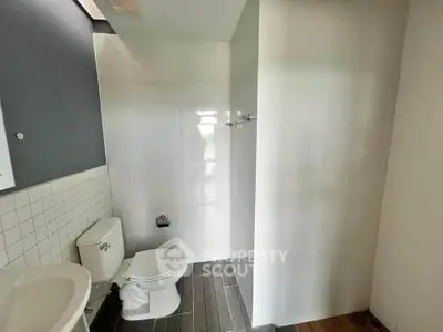 Modern bathroom with sleek design and white tiles