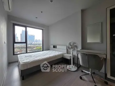Modern bedroom with city view, featuring a minimalist design and ample natural light.