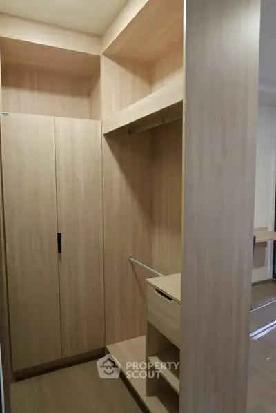 Spacious walk-in closet with wooden finish and ample storage space
