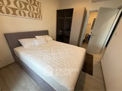 Cozy bedroom with modern decor and ample storage space