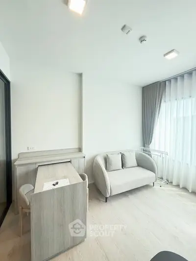 Modern living room with stylish furniture and natural light