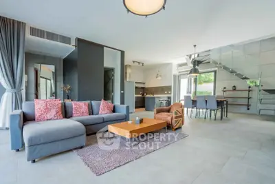Spacious modern living room with open kitchen and stylish decor