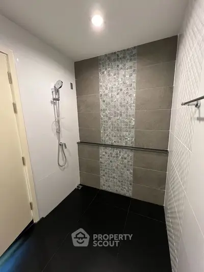 Modern bathroom with sleek shower design and stylish tile accents