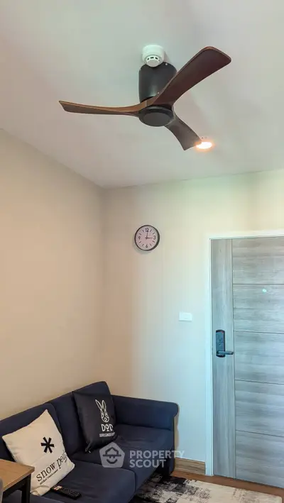 Cozy living room with modern ceiling fan and stylish decor