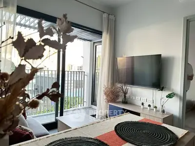 Modern living room with balcony access and stylish decor