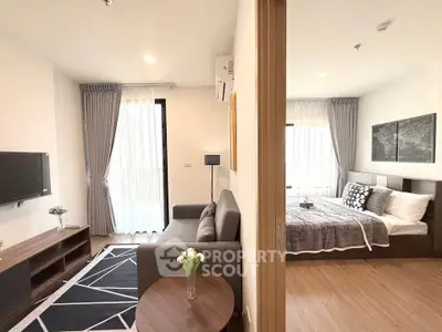 Modern apartment interior with cozy living room and stylish bedroom, featuring elegant decor and natural light.