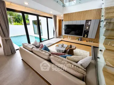 Luxurious living room with pool view and modern decor