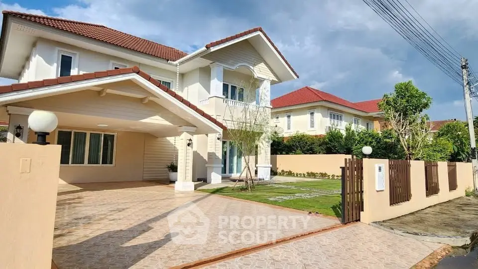 Stunning two-story house with spacious driveway and lush garden in a serene neighborhood.