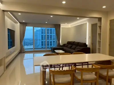 Spacious modern living room with city view, featuring elegant dining area and cozy seating.