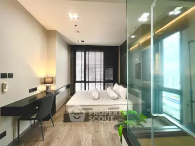 Modern bedroom with large window and sleek design in urban apartment