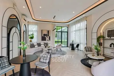Luxurious modern living room with elegant decor and large windows